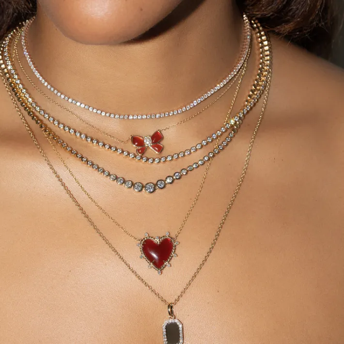 The Last Line Hand Carved Bow Necklace